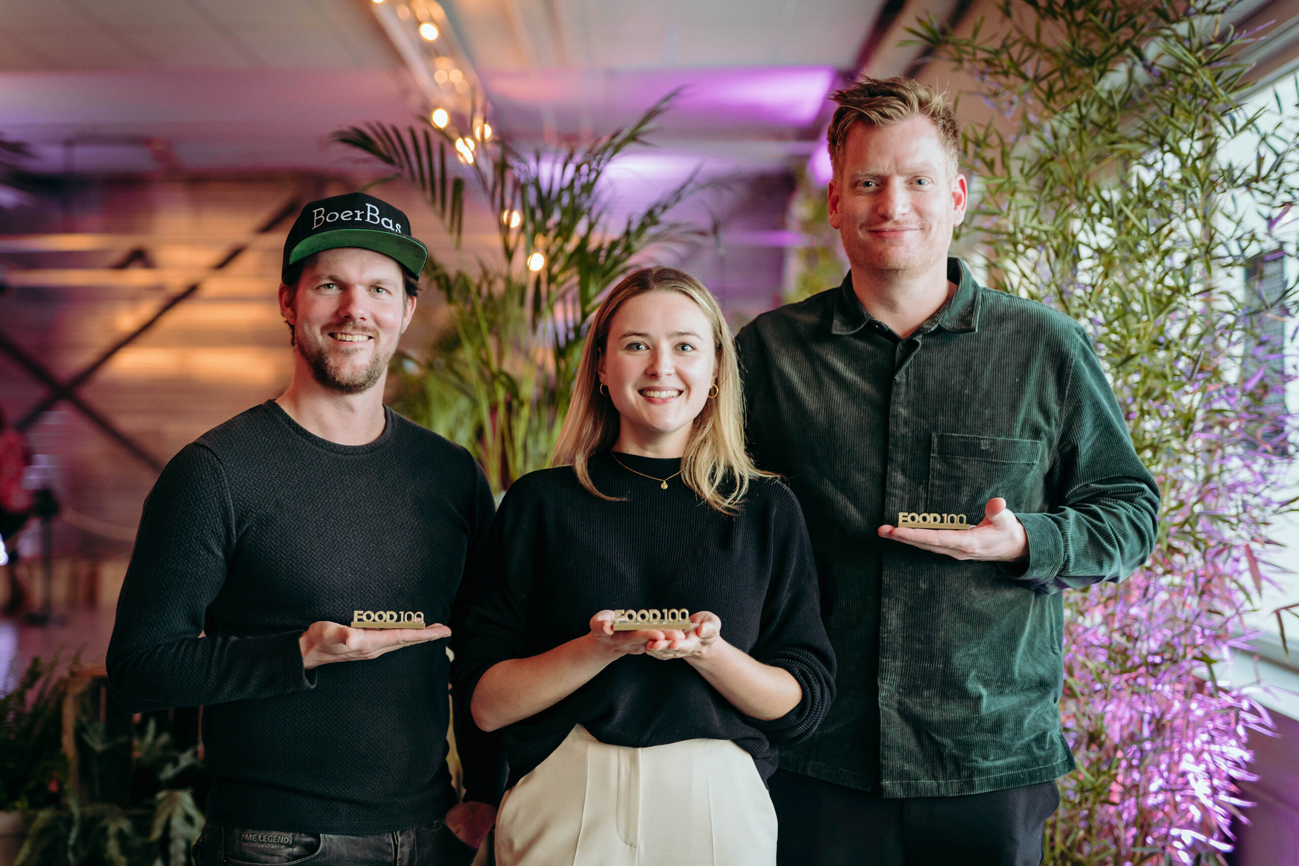 Three winners of the 2022 Food100 hold their prizes
